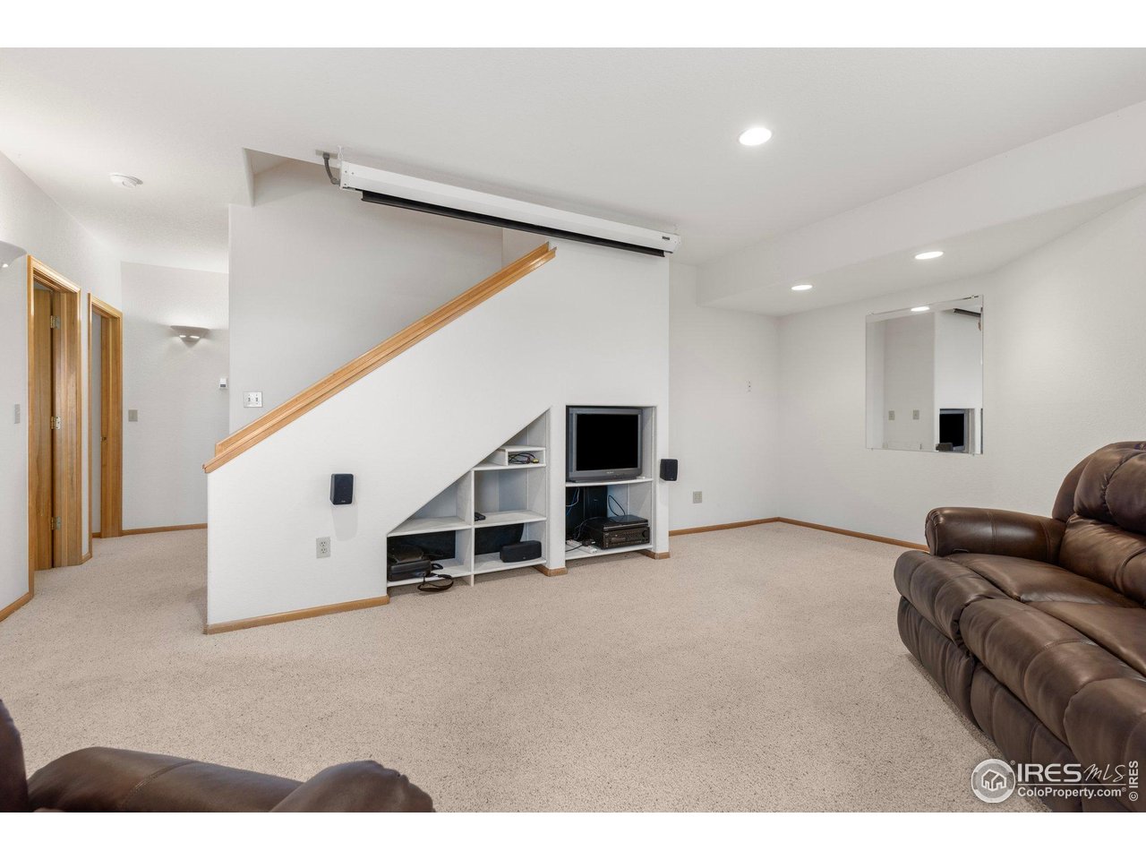 1117 Rock Lake Road Ward, CO 80481 - Photo 27 of 40 Lower level family room with screen and projector included.