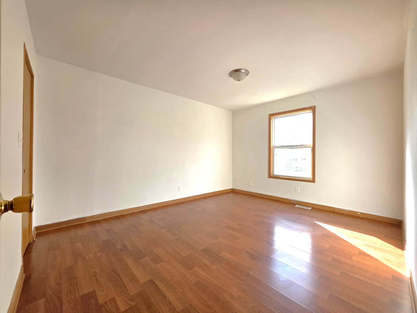 2513 Ridgefield Drive Belvidere, IL 61008 - Photo 23 of 35 an empty room with wooden floor and windows
