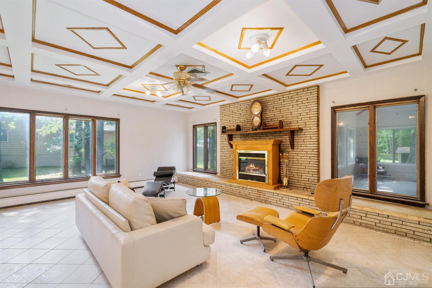 109 Fresh Ponds Road Monroe Township, NJ 08831 - Photo 13 of 83 a living room with furniture and a fireplace