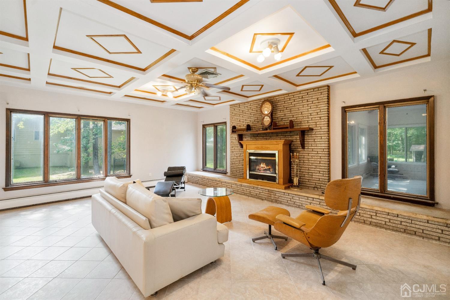 109 Fresh Ponds Road Monroe Township, NJ 08831 - Photo 14 of 83 a living room with furniture and a fireplace
