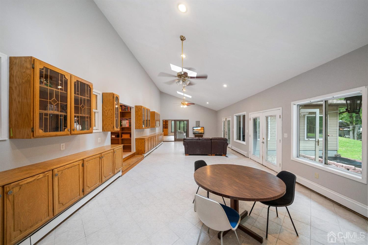 109 Fresh Ponds Road Monroe Township, NJ 08831 - Photo 22 of 83 a living room with stainless steel appliances kitchen island granite countertop furniture and a kitchen view