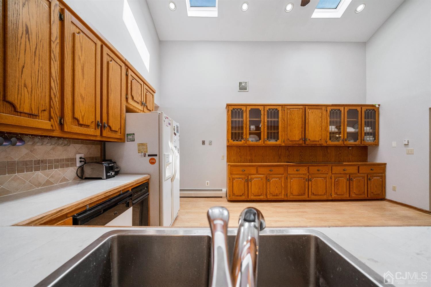 109 Fresh Ponds Road Monroe Township, NJ 08831 - Photo 30 of 83 a kitchen with stainless steel appliances granite countertop a refrigerator and a sink