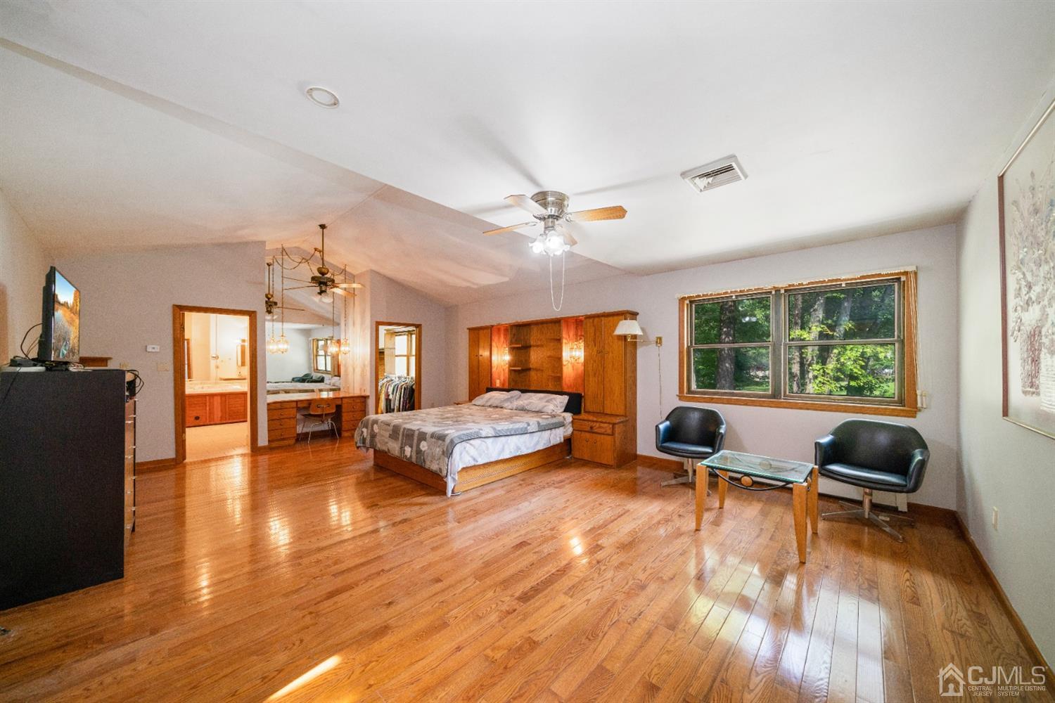 109 Fresh Ponds Road Monroe Township, NJ 08831 - Photo 31 of 83 a living room with furniture and a wooden floor