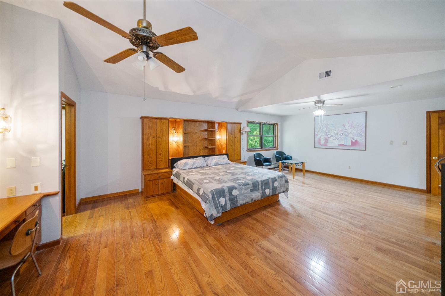 109 Fresh Ponds Road Monroe Township, NJ 08831 - Photo 33 of 83 a living room with a bed furniture and a wooden floor