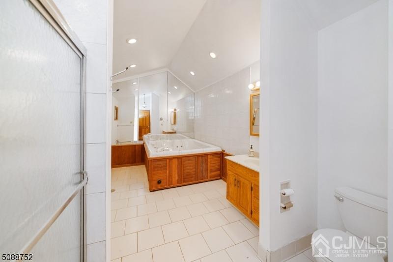 109 Fresh Ponds Road Monroe Township, NJ 08831 - Photo 40 of 83 a large bathroom with a large mirror vanity and toilet