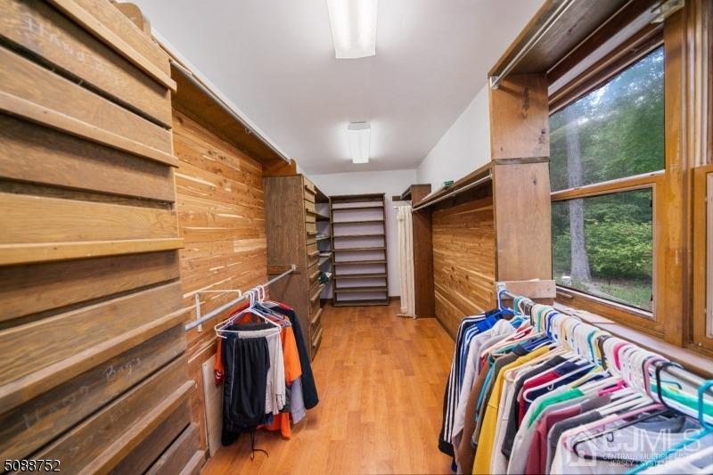 109 Fresh Ponds Road Monroe Township, NJ 08831 - Photo 47 of 83 a view of walk in closet with clothes and shoes