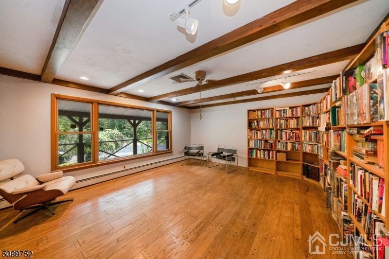 109 Fresh Ponds Road Monroe Township, NJ 08831 - Photo 49 of 83 a big room with wooden floor and furniture