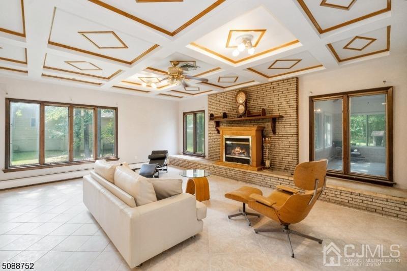 109 Fresh Ponds Road Monroe Township, NJ 08831 - Photo 61 of 83 a living room with furniture and a fireplace
