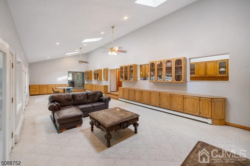 109 Fresh Ponds Road Monroe Township, NJ 08831 - Photo 65 of 83 a living room with furniture and a wooden floor