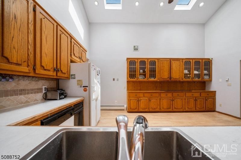 109 Fresh Ponds Road Monroe Township, NJ 08831 - Photo 76 of 83 a kitchen with stainless steel appliances a refrigerator and a stove