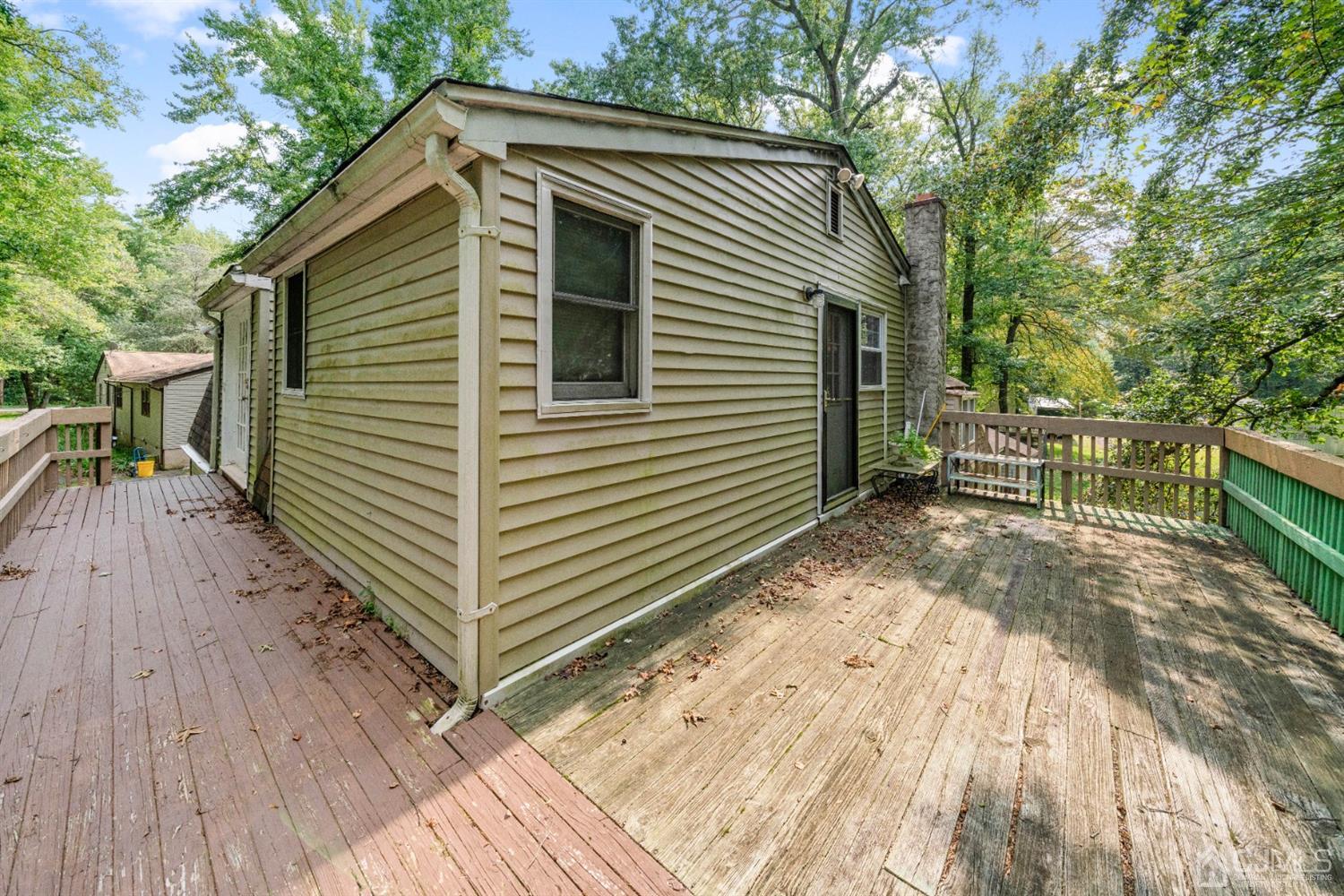 109 Fresh Ponds Road Monroe Township, NJ 08831 - Photo 82 of 83 a view of wooden house with a yard