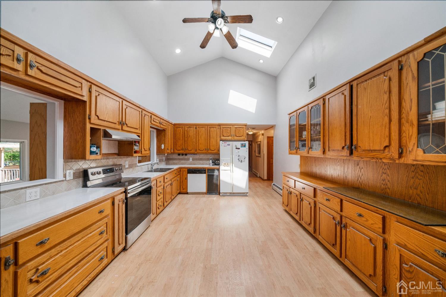 109 Fresh Ponds Road Monroe Township, NJ 08831 - Photo 10 of 83 a large kitchen with stainless steel appliances granite countertop a lot of counter space and wooden floor