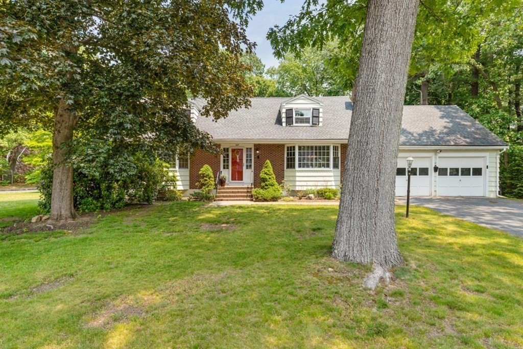 8 Candlewood Road Lynnfield, MA 01940 - Photo 1 of 41 a view of a house with a yard table and chairs