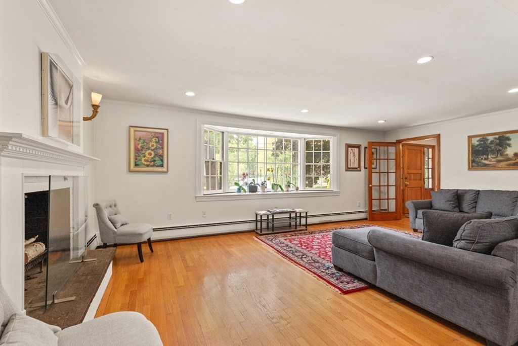 8 Candlewood Road Lynnfield, MA 01940 - Photo 11 of 41 a living room with furniture and a flat screen tv