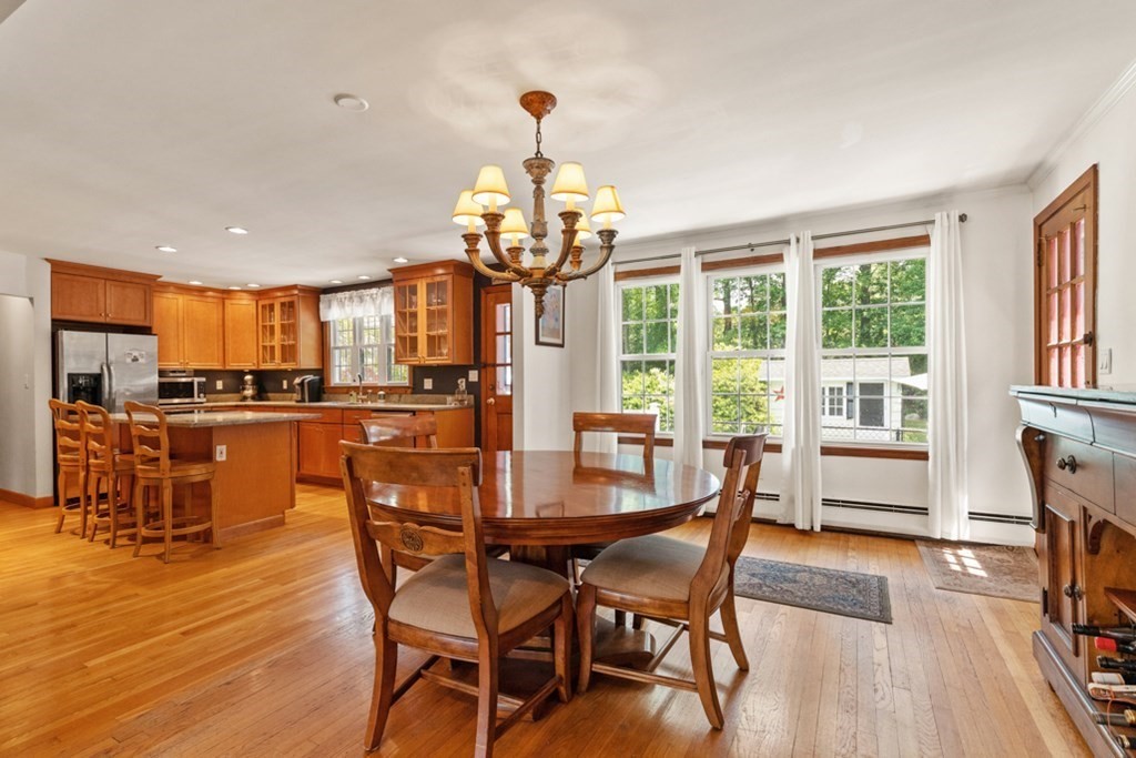 8 Candlewood Road Lynnfield, MA 01940 - Photo 14 of 41 a dining room with furniture a chandelier and wooden floor