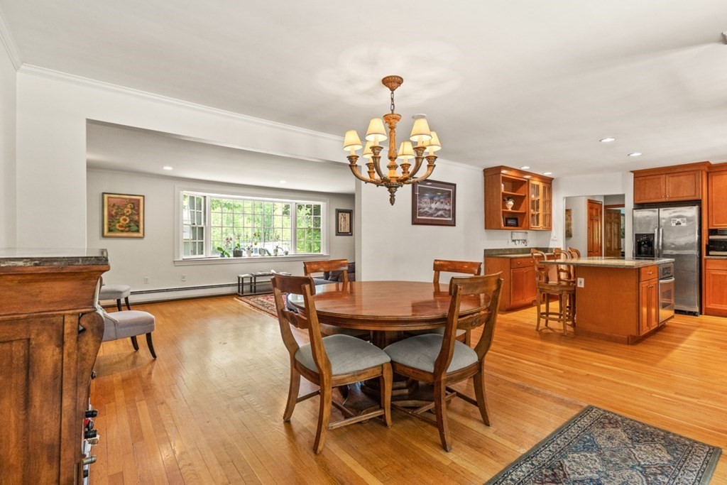 8 Candlewood Road Lynnfield, MA 01940 - Photo 15 of 41 a view of a dining room with furniture and chandelier