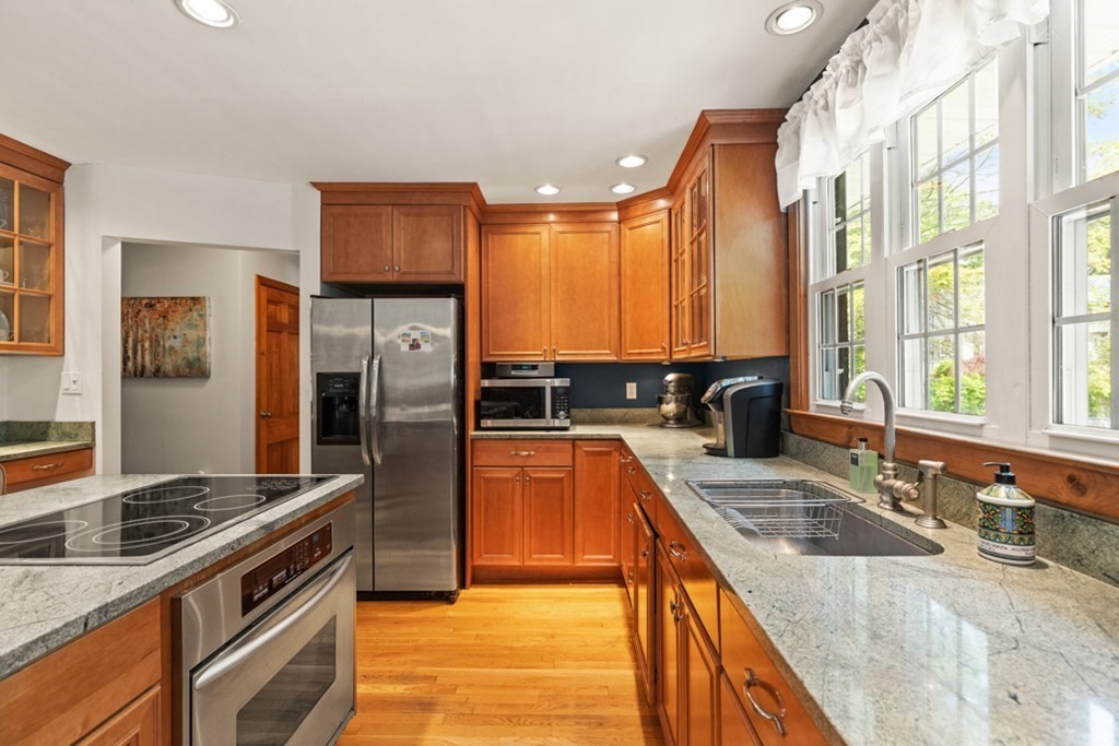 8 Candlewood Road Lynnfield, MA 01940 - Photo 17 of 41 a kitchen with stainless steel appliances granite countertop a sink stove and refrigerator