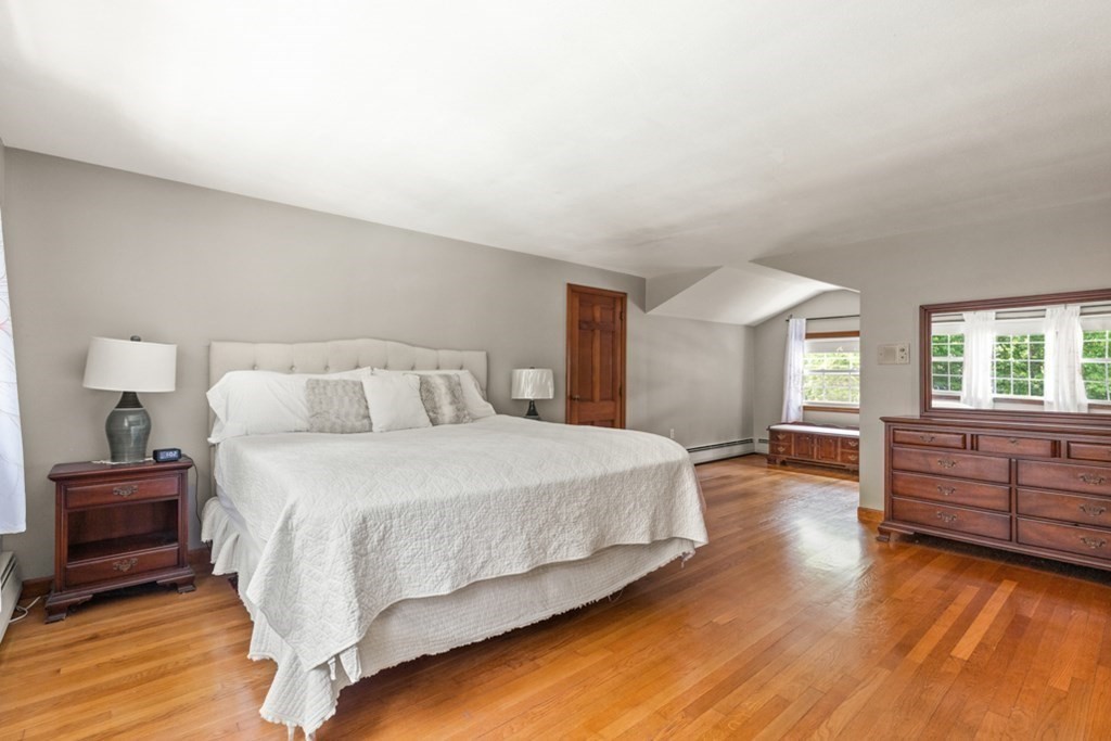 8 Candlewood Road Lynnfield, MA 01940 - Photo 25 of 41 a spacious bedroom with a bed and wooden floor