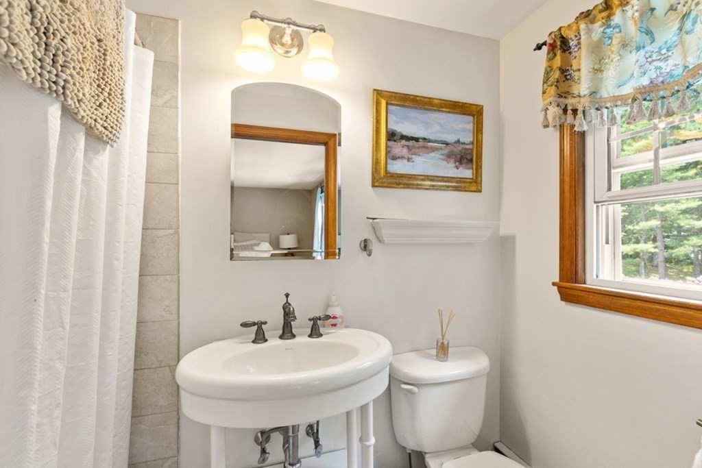 8 Candlewood Road Lynnfield, MA 01940 - Photo 28 of 41 a bathroom with a toilet sink and mirror