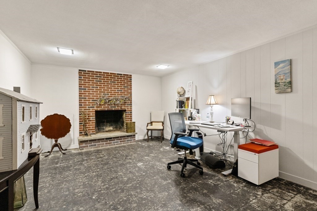 8 Candlewood Road Lynnfield, MA 01940 - Photo 29 of 41 a living room with furniture and a fireplace