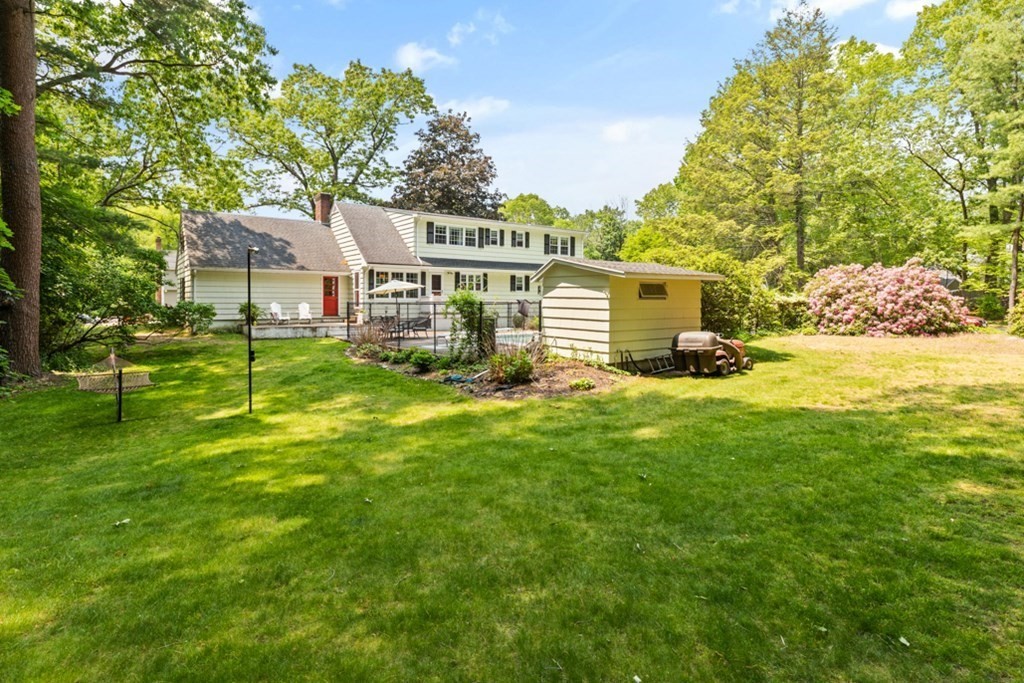 8 Candlewood Road Lynnfield, MA 01940 - Photo 32 of 41 a front view of a house with a garden