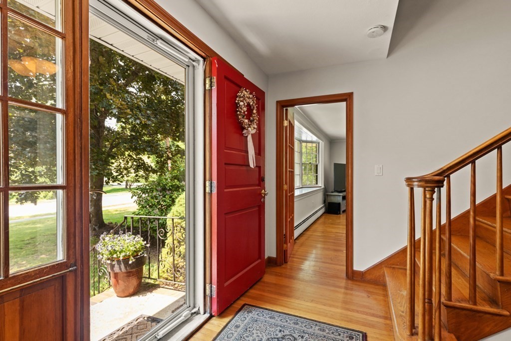 8 Candlewood Road Lynnfield, MA 01940 - Photo 7 of 41 a hallway with wooden floor chandelier and entryway