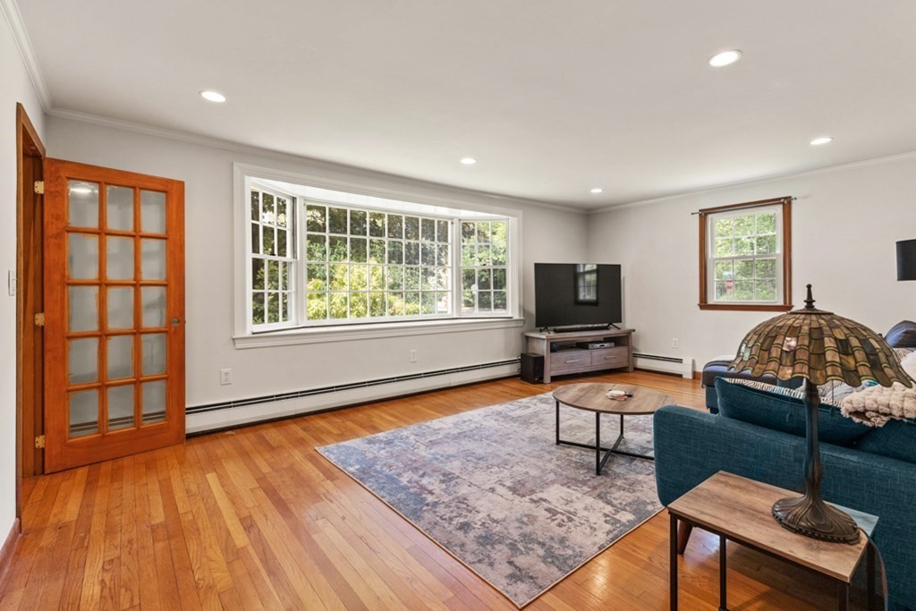 8 Candlewood Road Lynnfield, MA 01940 - Photo 9 of 41 a living room with furniture and a flat screen tv