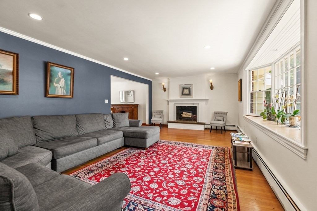 8 Candlewood Road Lynnfield, MA 01940 - Photo 10 of 41 a living room with furniture and a fireplace