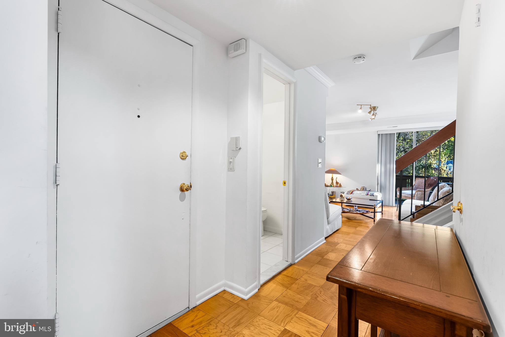 110 Cross Keys Road, Unit F Baltimore, MD 21210 - Photo 16 of 47 a living room with furniture and a flat screen tv