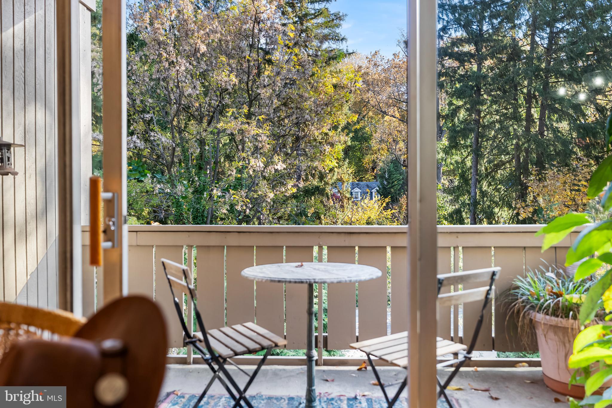 110 Cross Keys Road, Unit F Baltimore, MD 21210 - Photo 18 of 47 a view of balcony with a table and chairs and potted plants