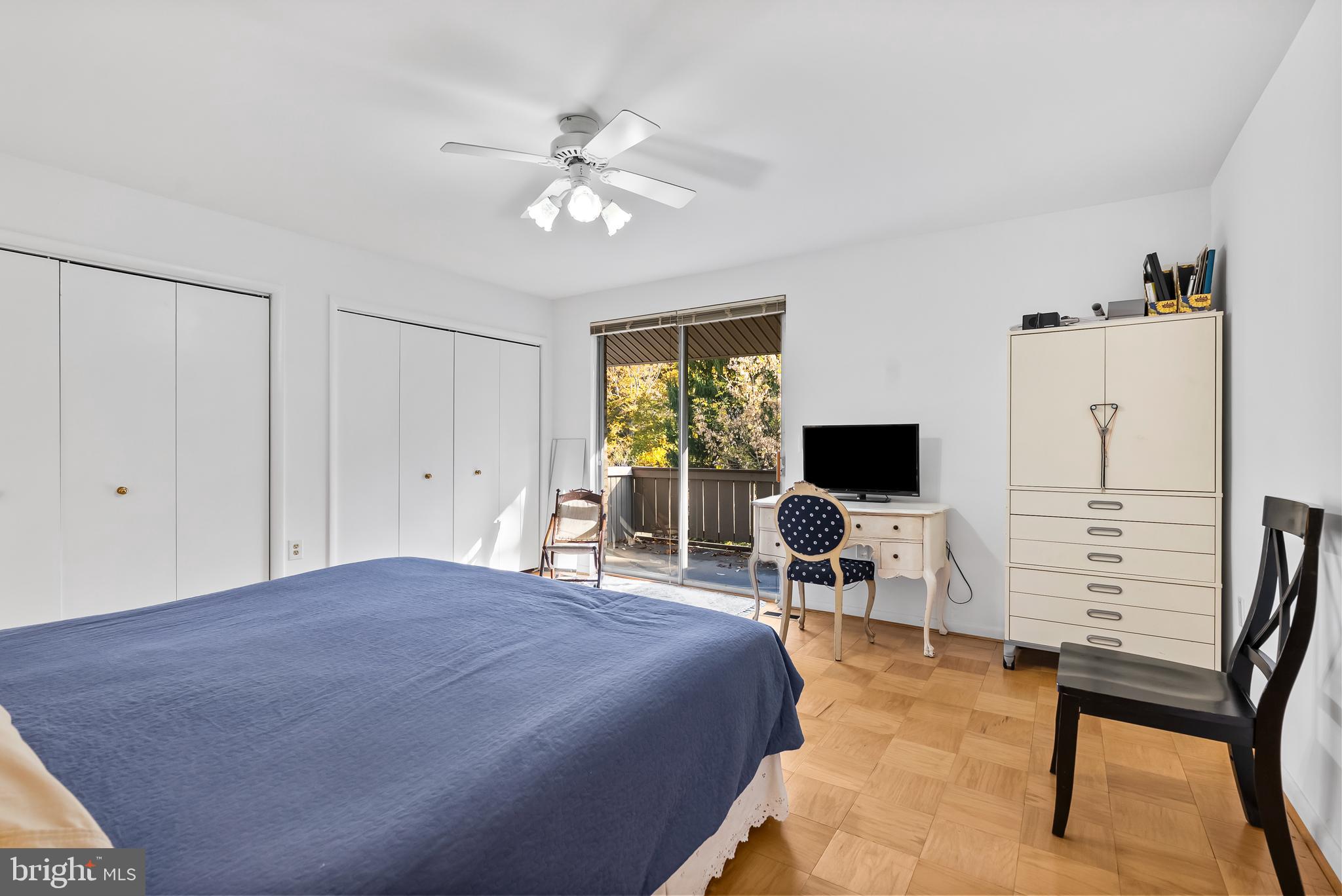 110 Cross Keys Road, Unit F Baltimore, MD 21210 - Photo 25 of 47 a bedroom with a bed and a chair