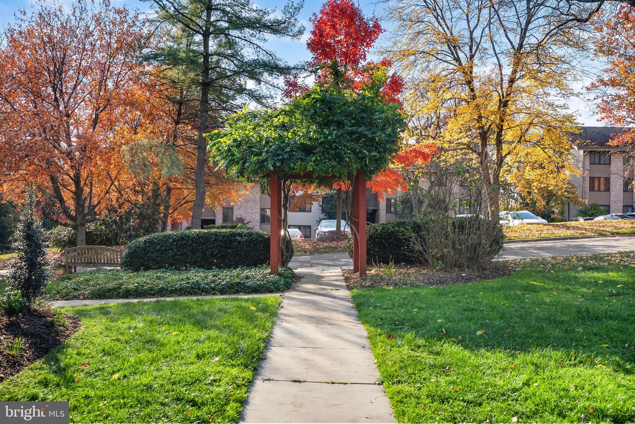 110 Cross Keys Road, Unit F Baltimore, MD 21210 - Photo 28 of 47 a front view of a house with garden and trees