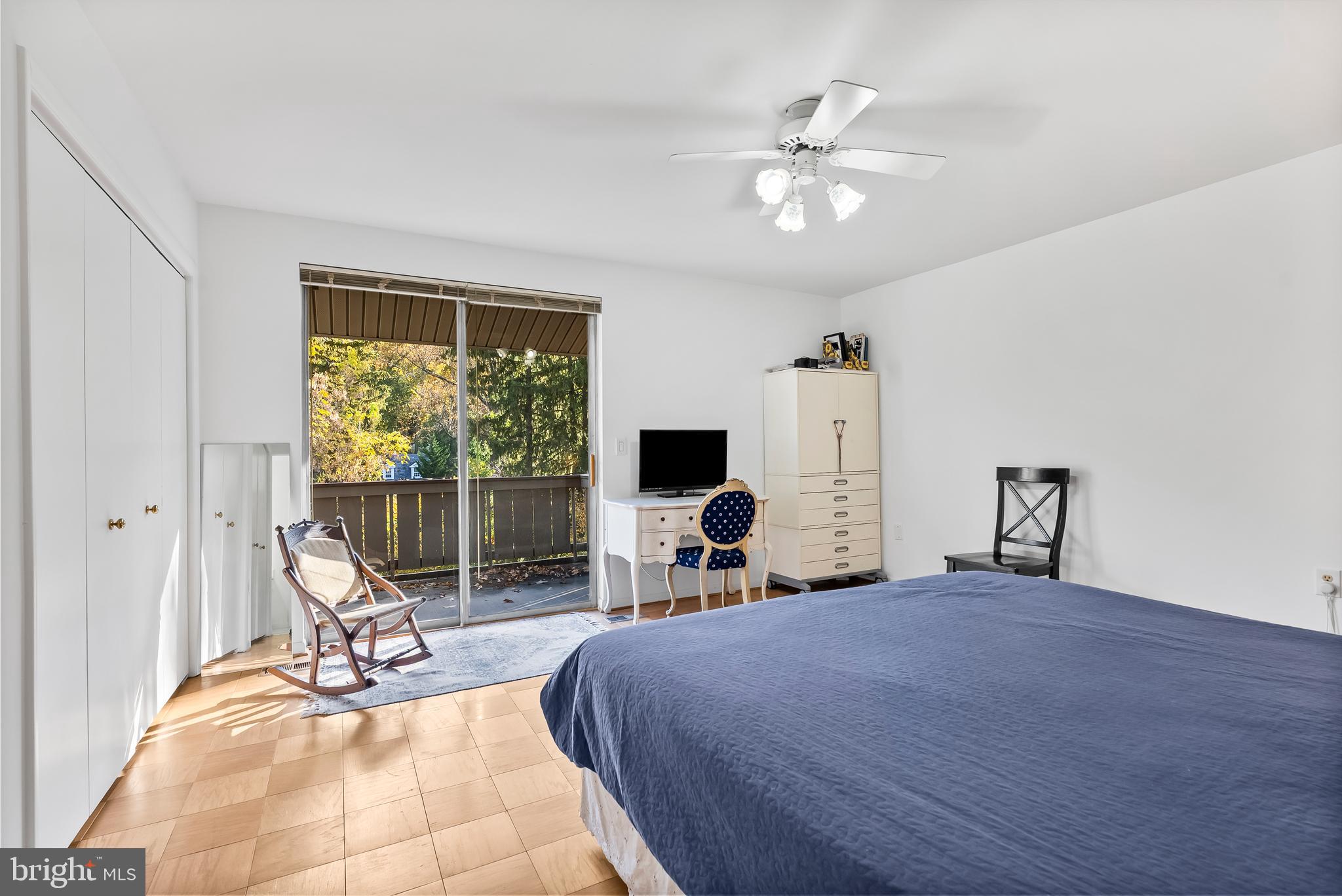 110 Cross Keys Road, Unit F Baltimore, MD 21210 - Photo 37 of 47 a bedroom with a bed and a chandelier