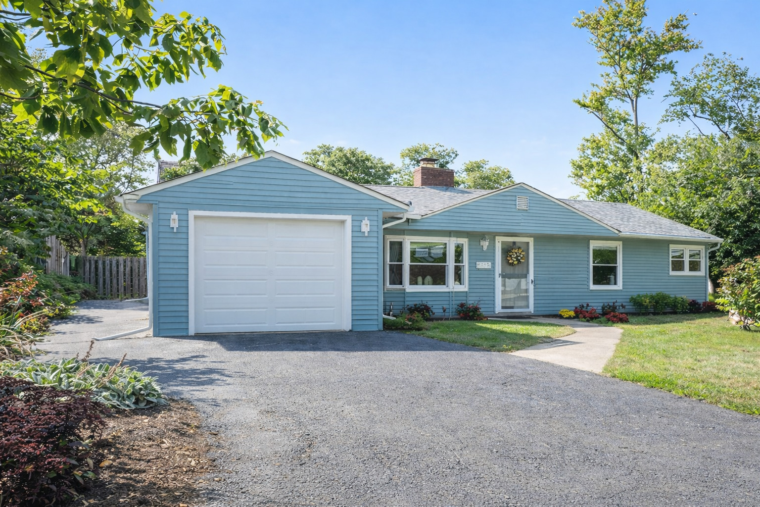 223 Miami Street Park Forest, IL 60466 - Photo 1 of 21 a front view of a house with a yard and garage