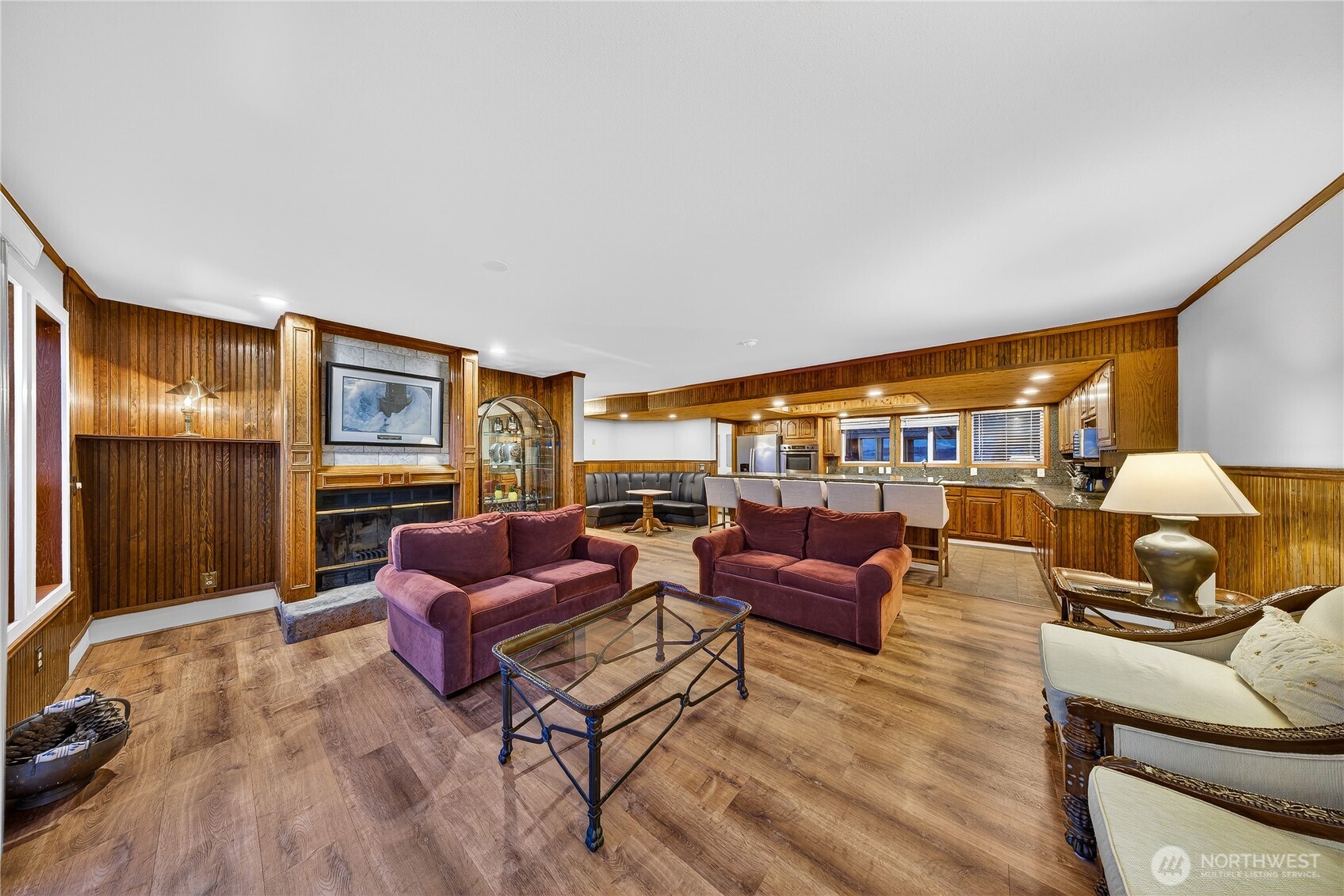 5972 Hastings Road Clinton, WA 98236 - Photo 28 of 40 a living room with furniture fireplace and a flat screen tv