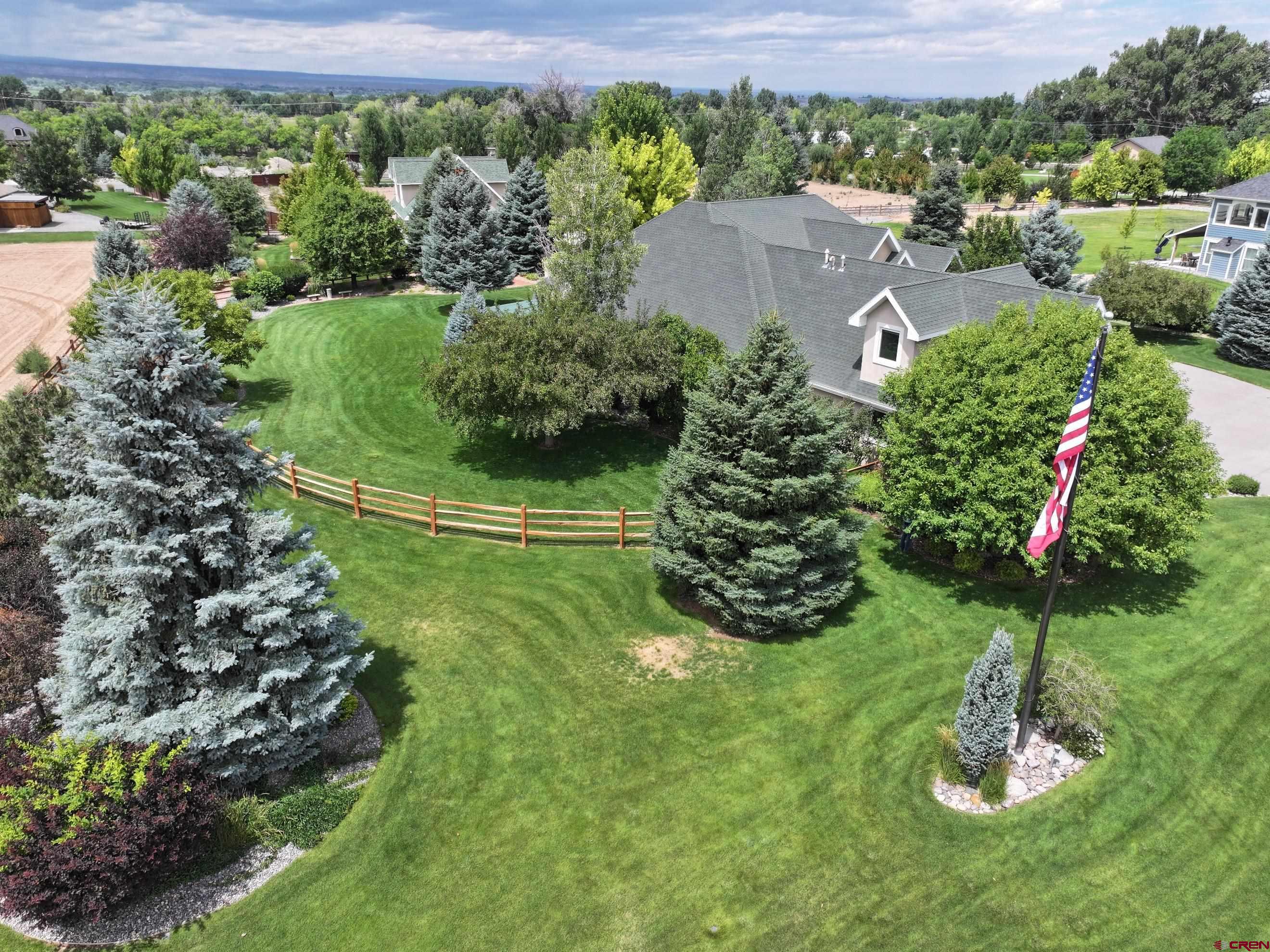 15103 6260th Road Montrose, CO 81403 - Photo 7 of 45 a view of a garden with a house