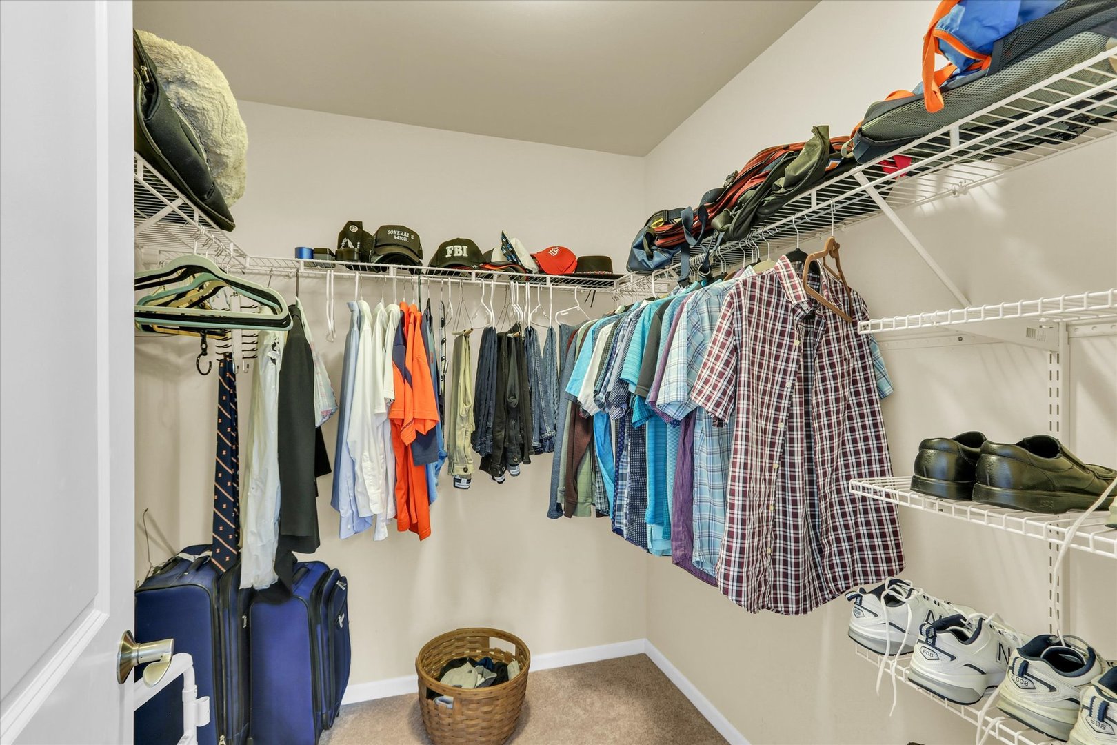 2730 Madelynn Drive Champaign, IL 61822 - Photo 12 of 35 a view of walk in closet with clothes and shoes