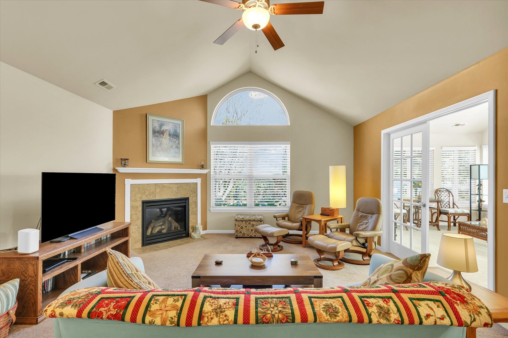 2730 Madelynn Drive Champaign, IL 61822 - Photo 14 of 35 a living room with furniture a flat screen tv and a fireplace