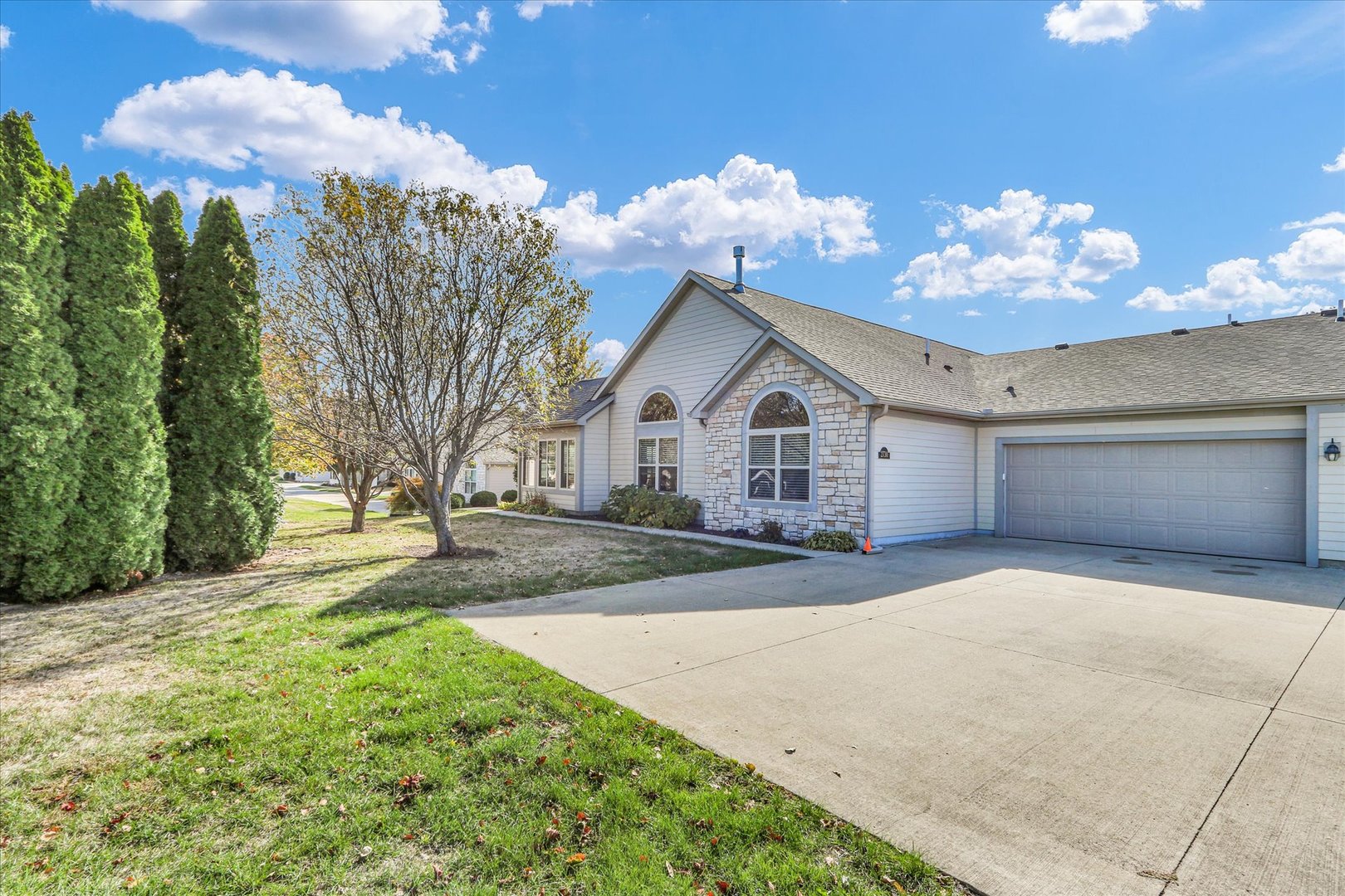 2730 Madelynn Drive Champaign, IL 61822 - Photo 2 of 35 a view of a house with a yard and garage