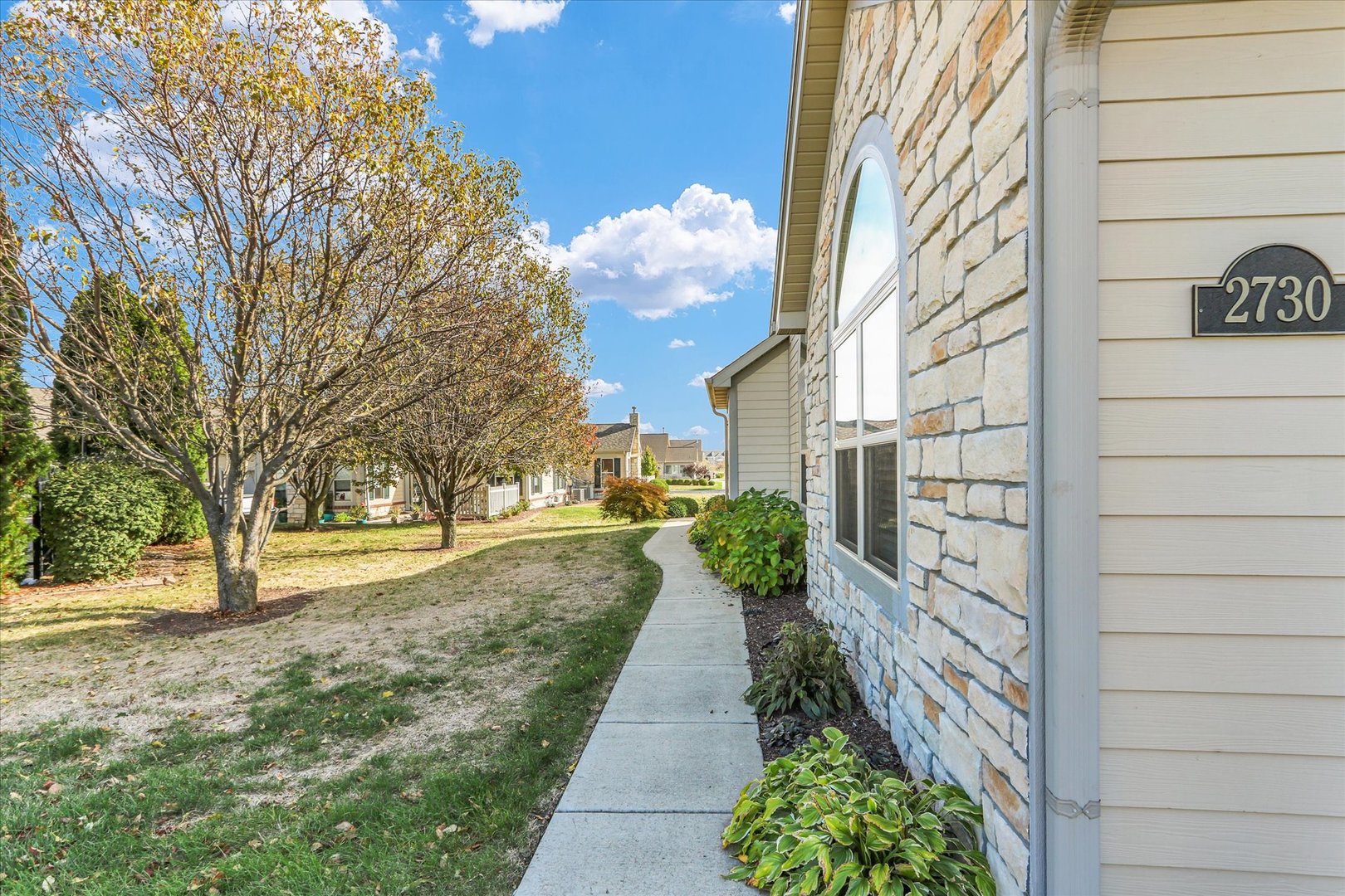 2730 Madelynn Drive Champaign, IL 61822 - Photo 4 of 35 a view of a pathway with a yard