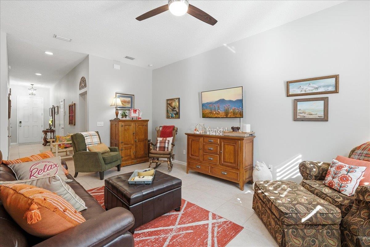 144 Litke Lane St. Augustine, FL 32086 - Photo 8 of 45 a living room with furniture and a flat screen tv