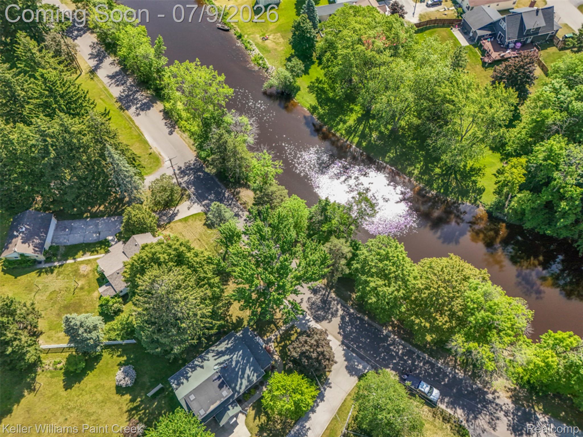204 Russell Road Kawkawlin, MI 48631 - Photo 67 of 82 Aerial perspective showcasing a residential area bordered by a river