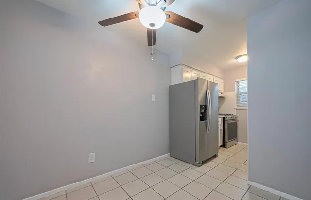 a kitchen with stainless steel appliances a sink stove and cabinets