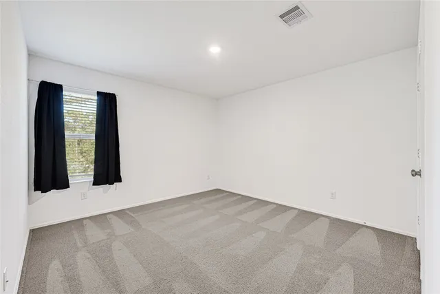 an empty room with window