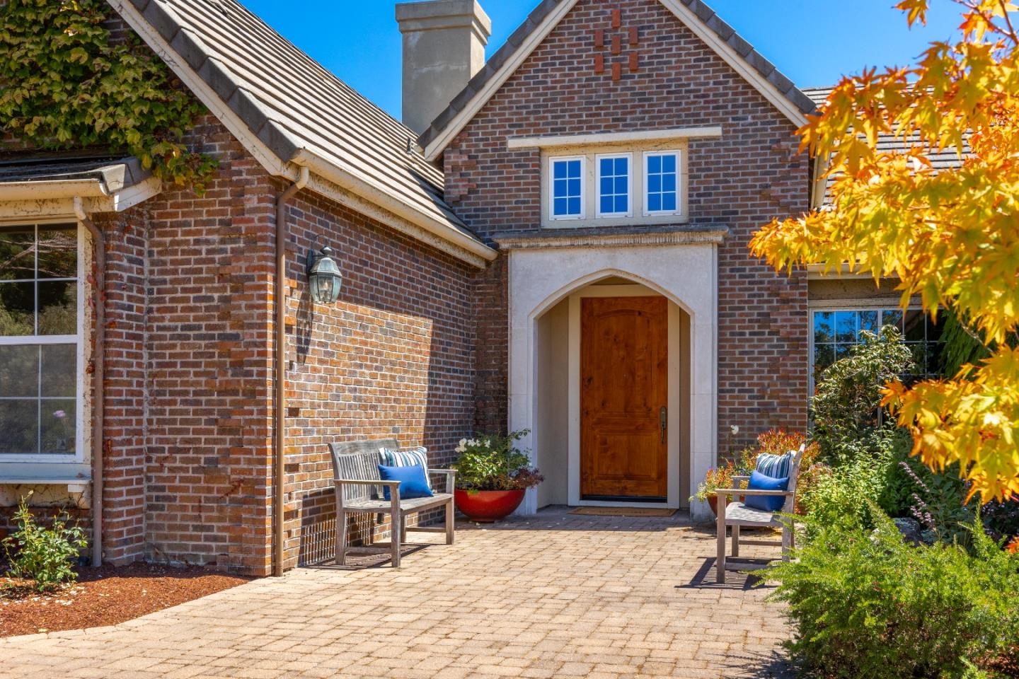 3918 Mainsail Place Soquel, CA 95073 - Photo 2 of 36 a view of a brick house with plants and chairs in patio