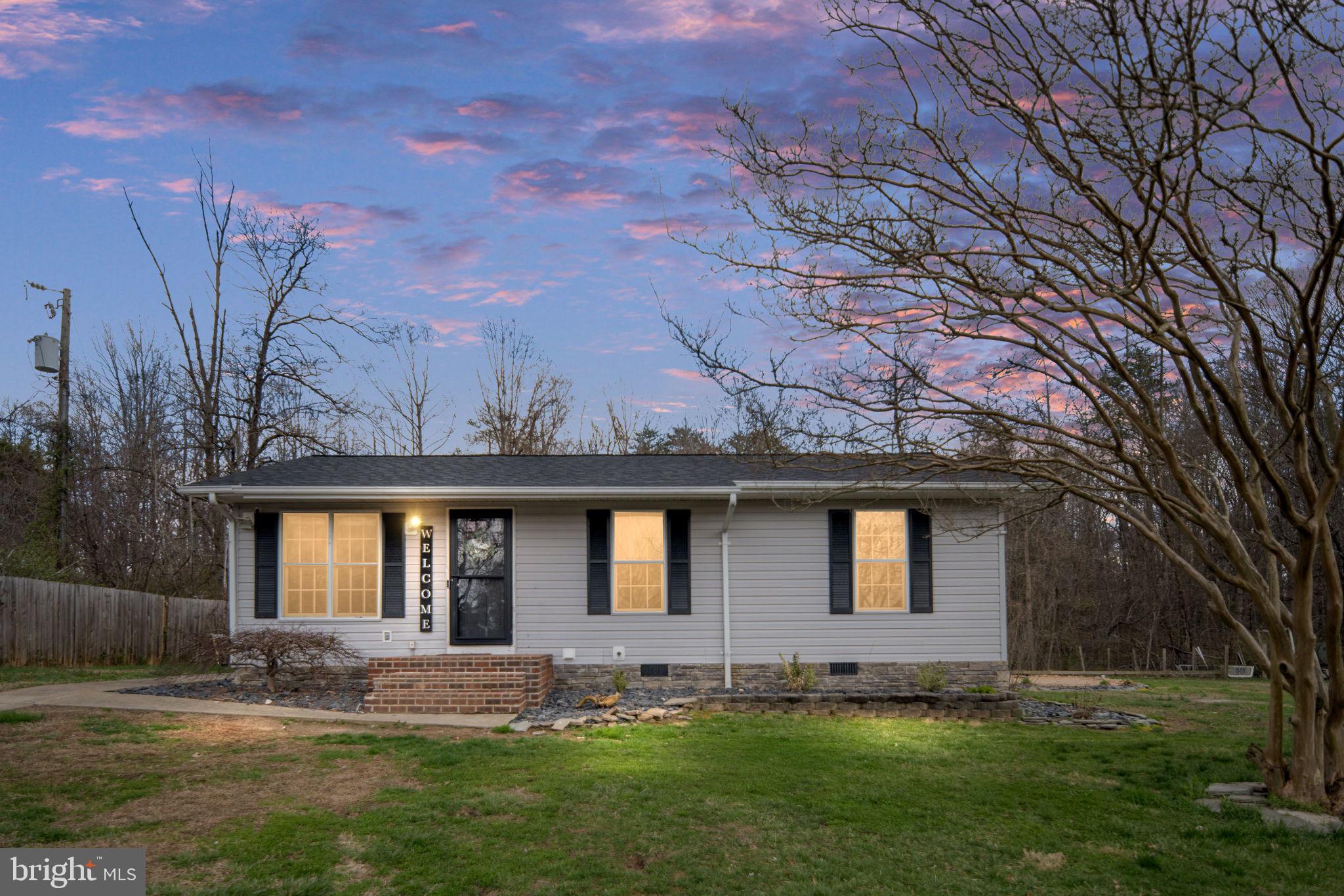 371 Greenbank Road Fredericksburg, VA 22406 - Photo 1 of 54 a front view of a house with a yard