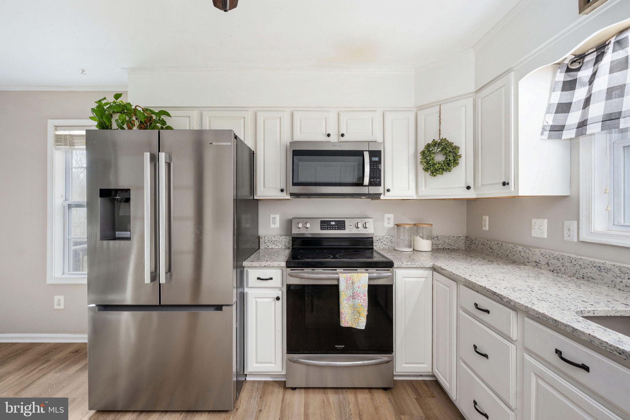 371 Greenbank Road Fredericksburg, VA 22406 - Photo 15 of 54 a kitchen with stainless steel appliances a refrigerator stove and microwave