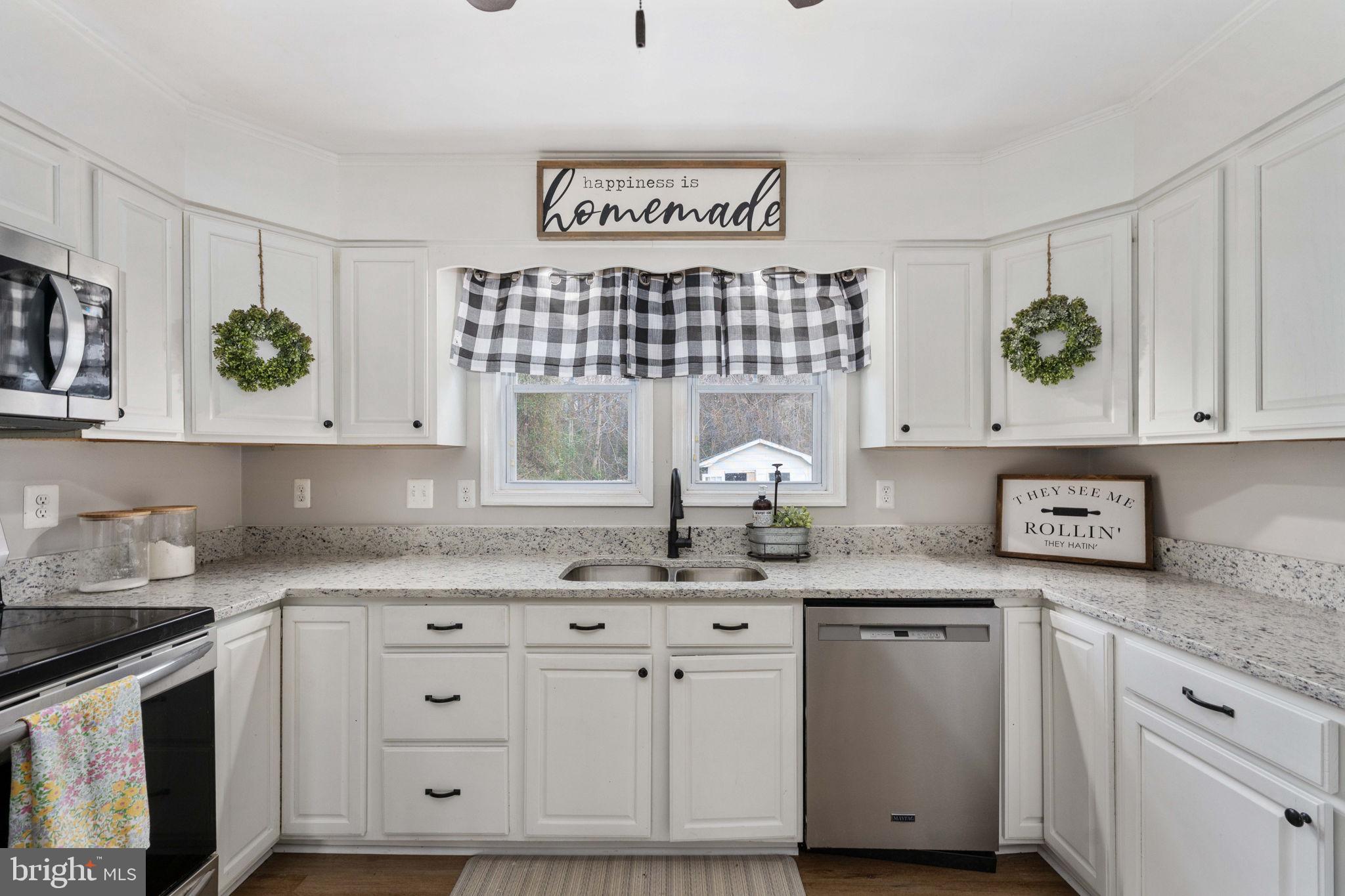 371 Greenbank Road Fredericksburg, VA 22406 - Photo 18 of 54 a kitchen with white cabinets and white appliances
