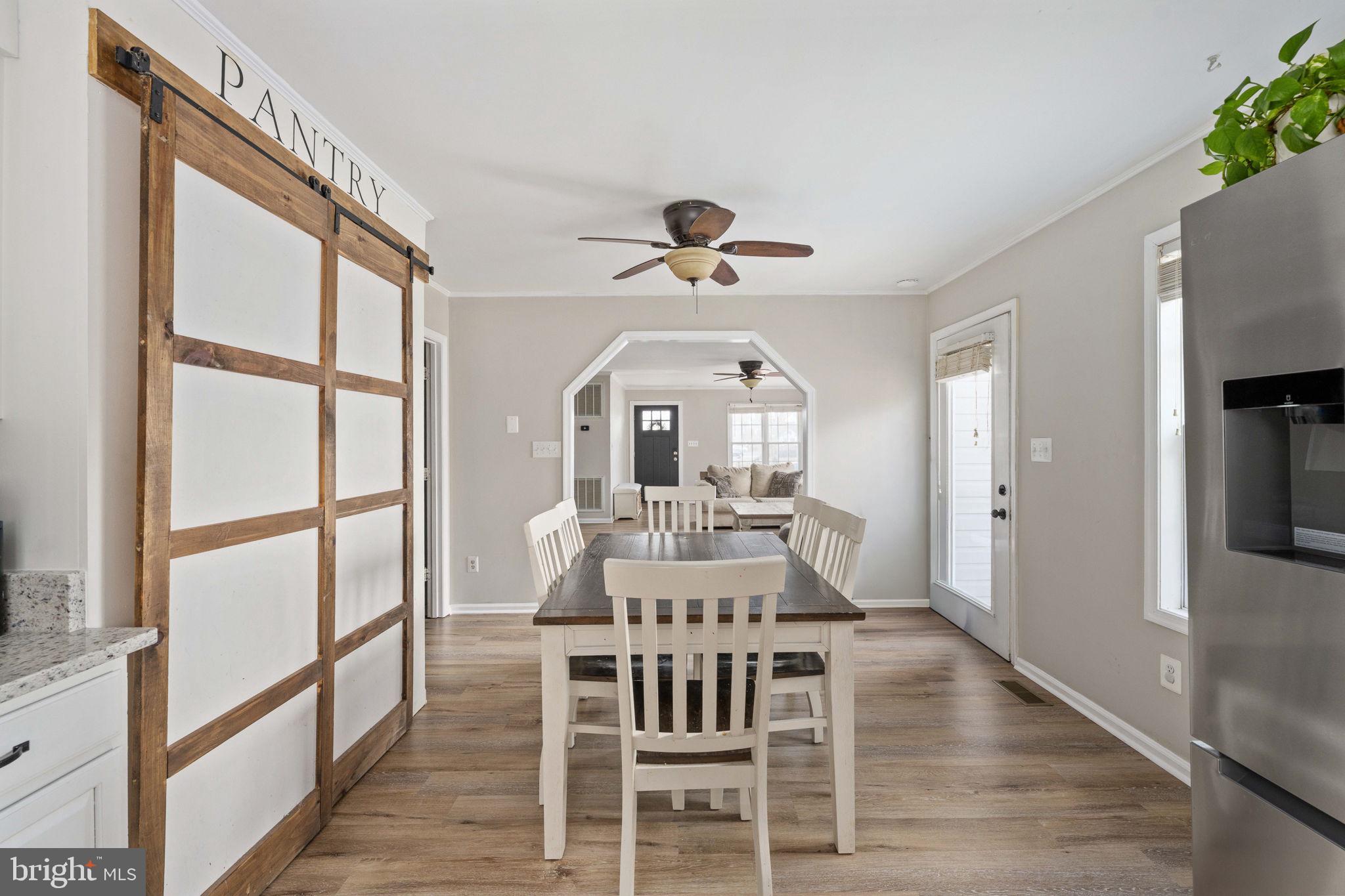 371 Greenbank Road Fredericksburg, VA 22406 - Photo 19 of 54 a view of a dining room with furniture window and wooden floor