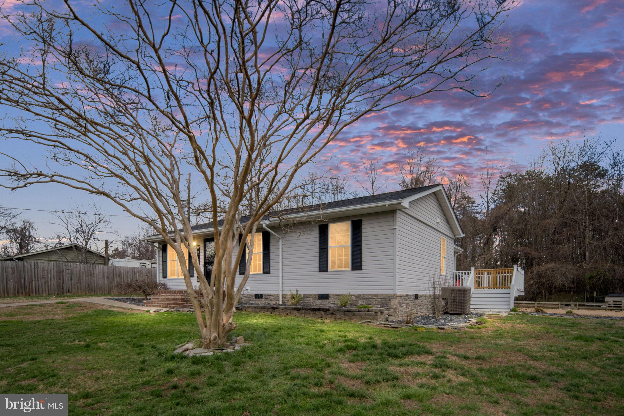 371 Greenbank Road Fredericksburg, VA 22406 - Photo 2 of 54 a backyard of a house with lots of green space